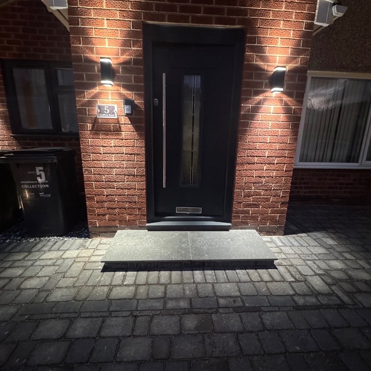 Finished paved entrance and front path