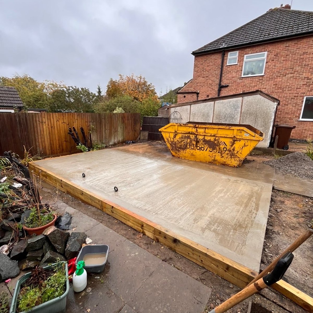 Concrete base preparation by GEM Landscaping for an outdoor structure