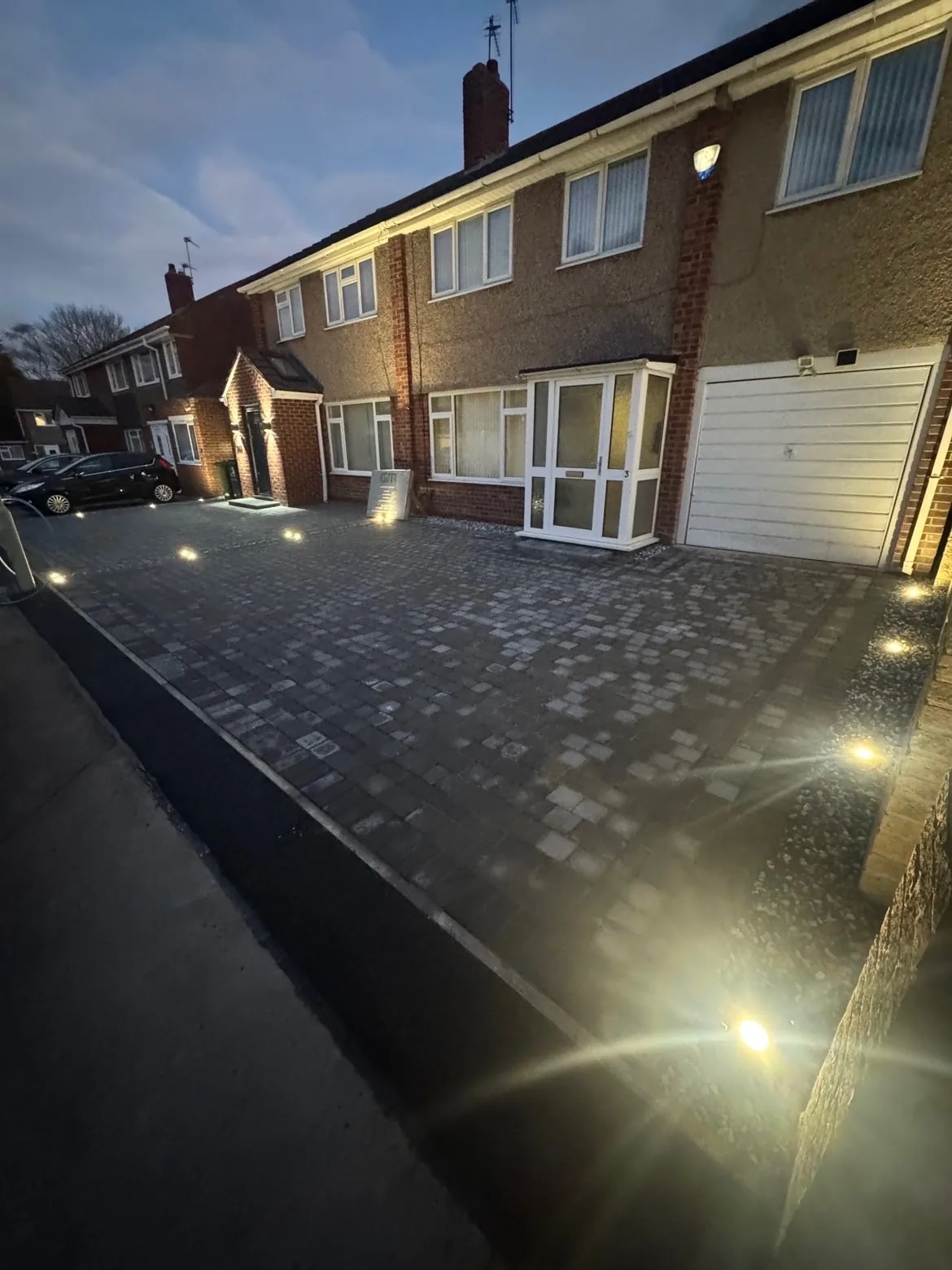 Completed block-paved driveway with lighting