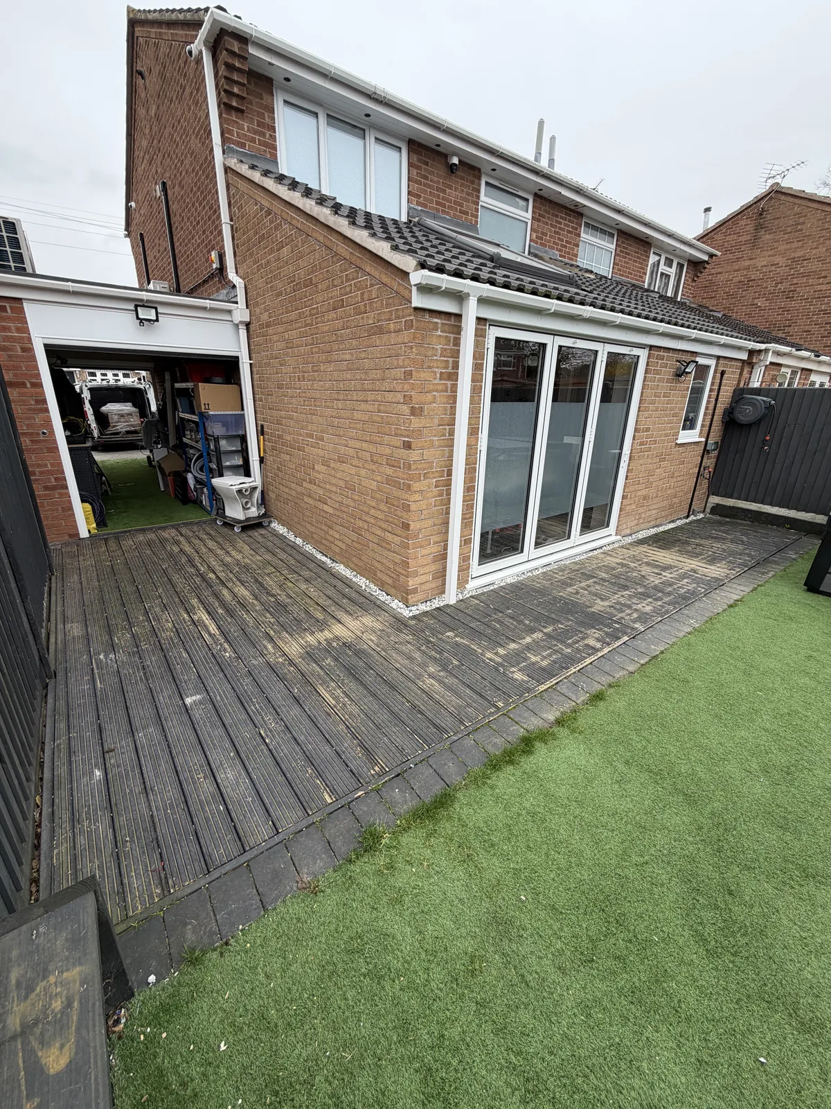 Rear garden with older decking before GEM landscaping work